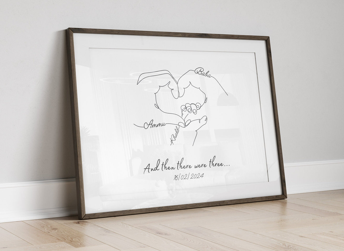 Newborn keepsake print displaying overlapping hands of parents and baby, customized with family details.