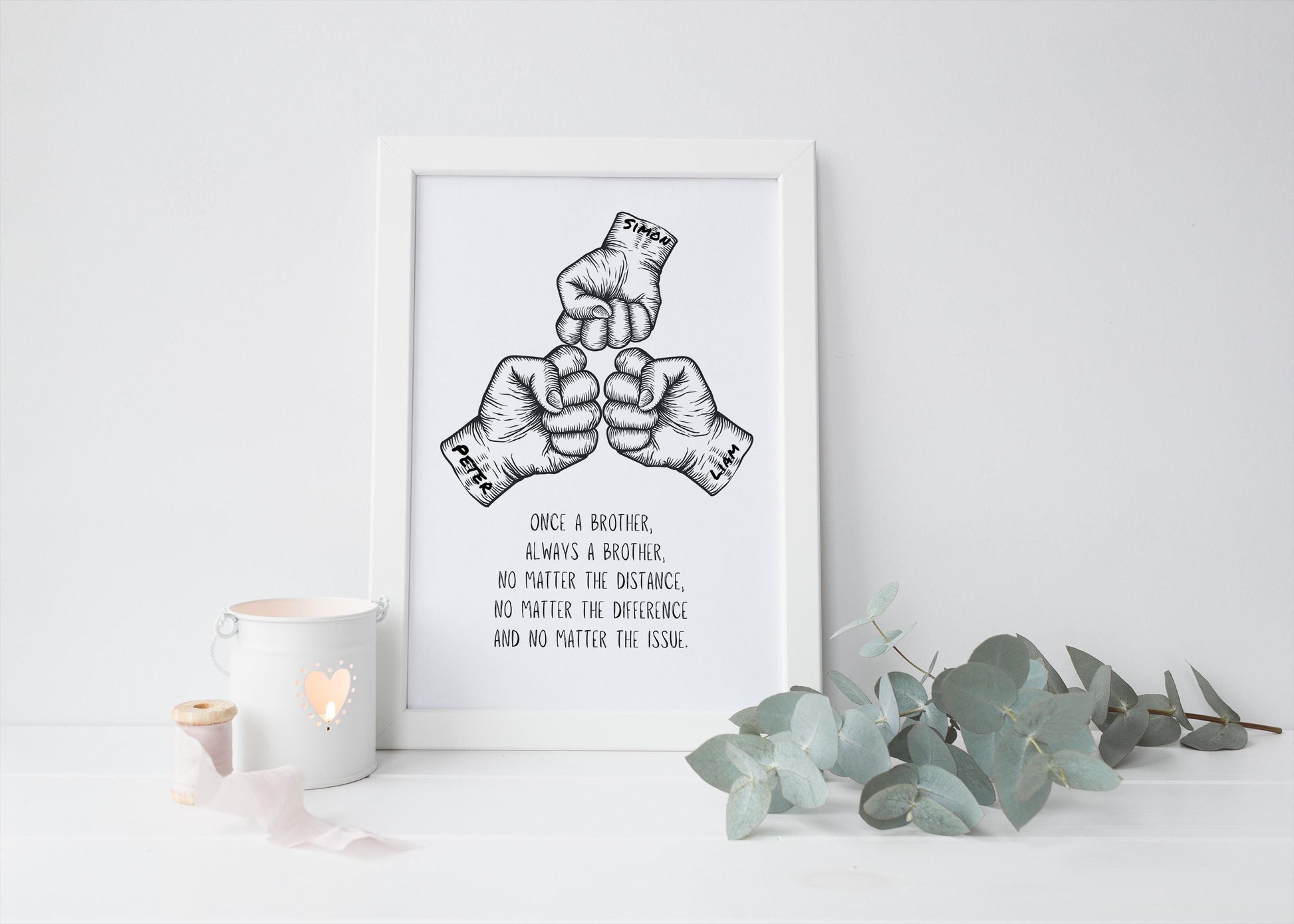 Framed wall art featuring a hand-drawn illustration of three fists in a fist bump gesture, accompanied by an inspirational quote about brotherhood. Perfect as a gift or home décor for celebrating sibling bonds