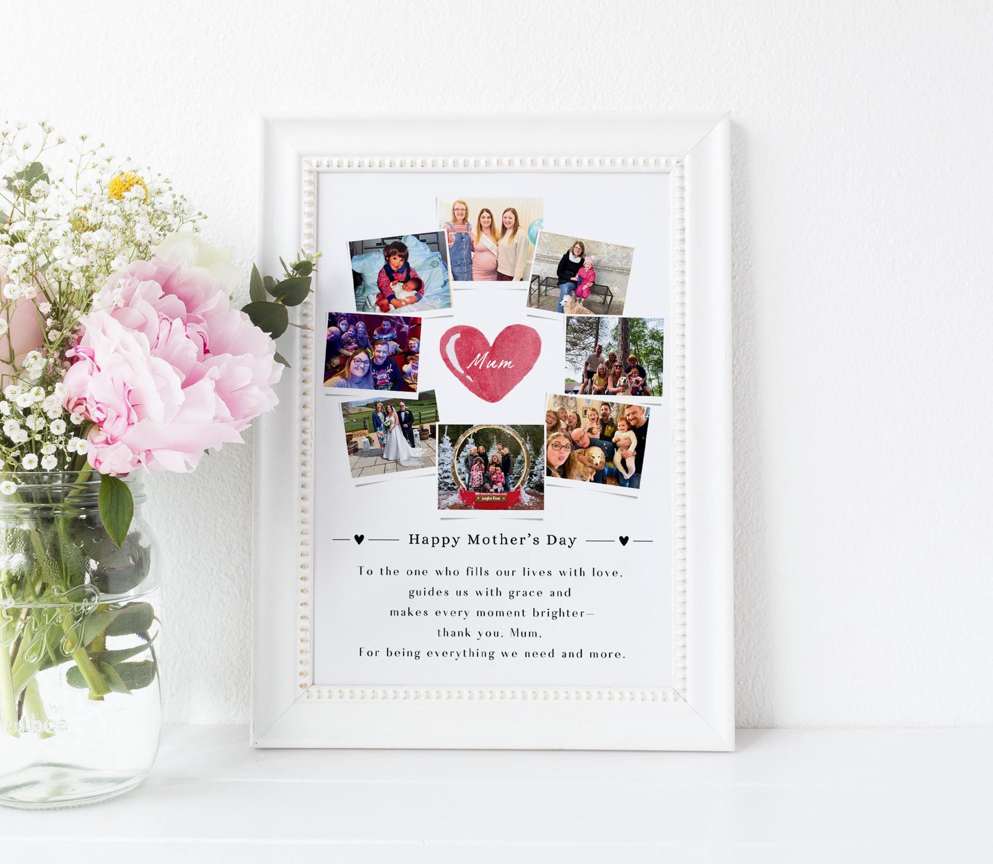 This is a framed Mother&#39;s Day collage featuring multiple family photos arranged around a central heart graphic that says &quot;Mum.&quot; The design includes a heartfelt message at the bottom that expresses love and gratitude for a mother’s guidance and presence. The frame can be black or white, and the background is white, giving it a clean and elegant look. The collage is placed against a light-colored wall on a wooden floor.