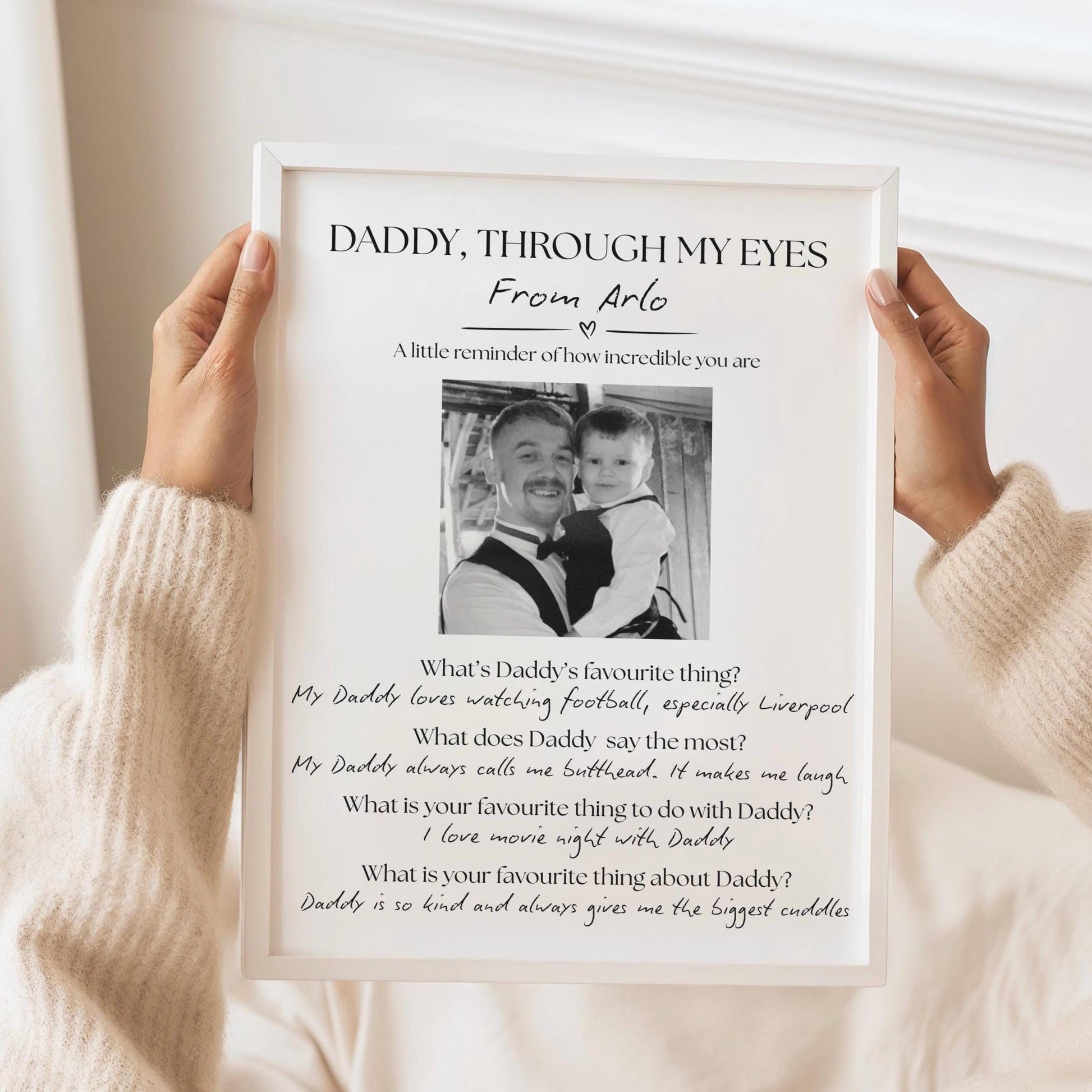 Personalized Father&#39;s Day print titled &#39;Dad in My Eyes&#39; featuring a child&#39;s name at the top, a central photo of the child and dad, and four heartfelt questions answered by the child: 1) What&#39;s Dad&#39;s favourite thing? 2) What does Dad say the most? 3) What is your favourite thing to do with Dad? 4) What is your favourite thing about Dad? A sentimental and custom keepsake gift celebrating the unique bond between father and child.